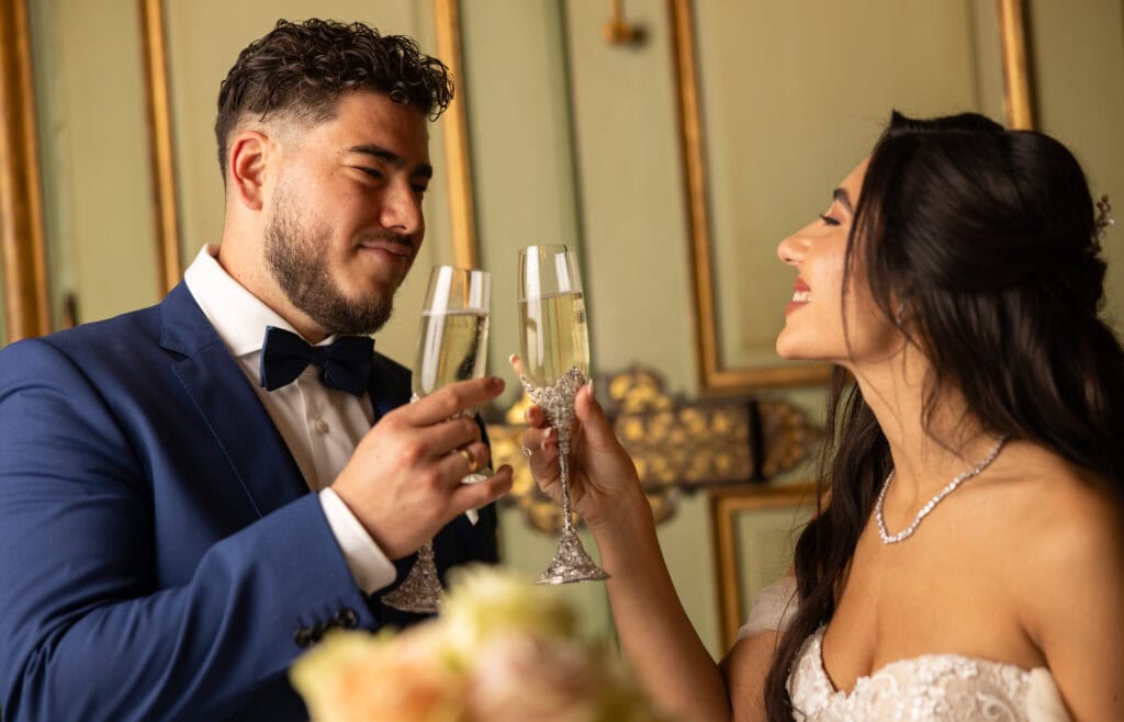 Emotional cake-cutting moment with bride and groom smiling at Villa Wenkenhof wedding in Switzerland.
