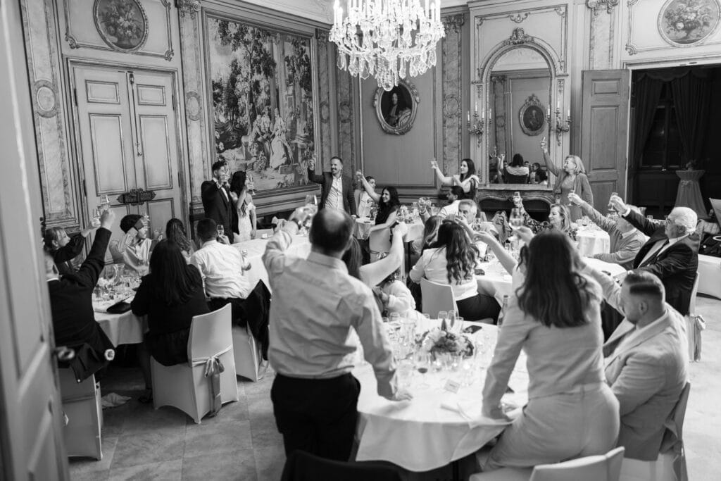 Toast with bride, groom and guests at Villa Wenkenhof wedding in Switzerland.