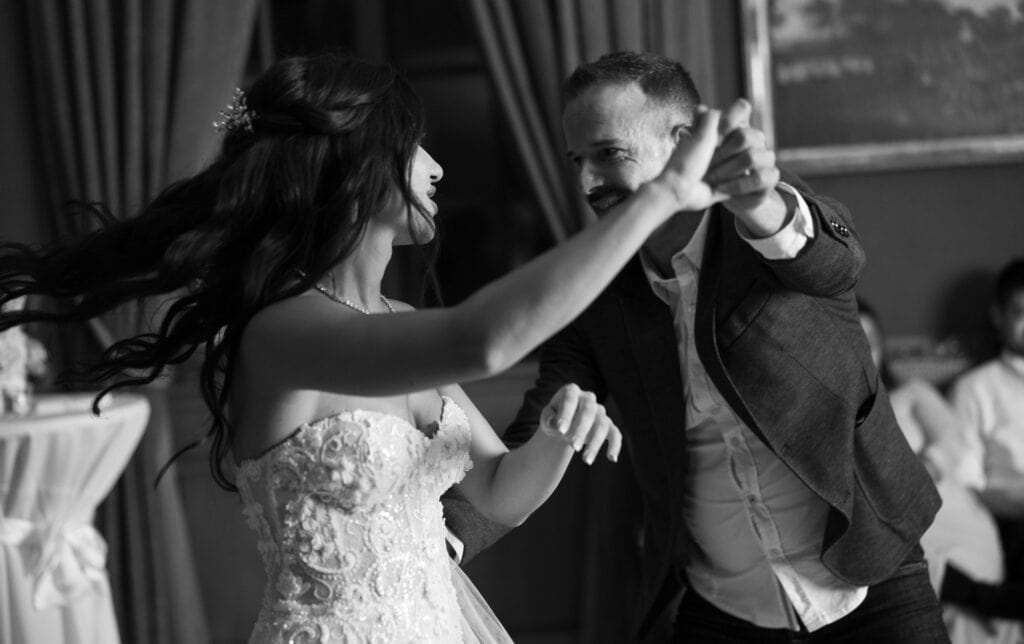 Bride dancing and celebrating during the wedding party at Villa Wenkenhof in Basel.