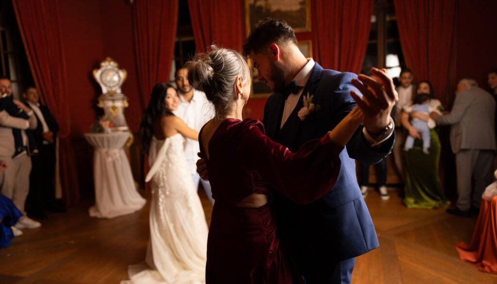Groom dancing with her mum and celebrating during the wedding party at Villa Wenkenhof in Basel.