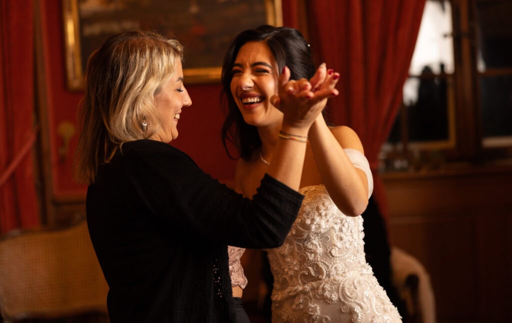 Bride dancing and celebrating during the wedding party at Villa Wenkenhof in Basel.