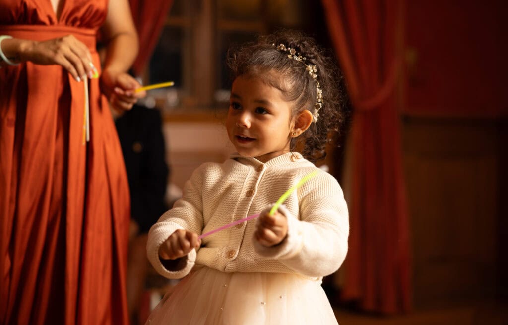 Kid playing and celebrating during the wedding party at Villa Wenkenhof in Basel.