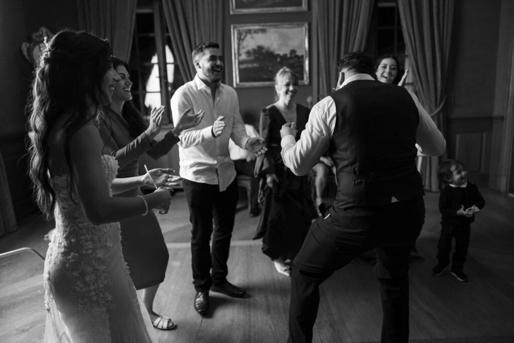 Guests dancing and celebrating during the wedding party at Villa Wenkenhof in Basel.