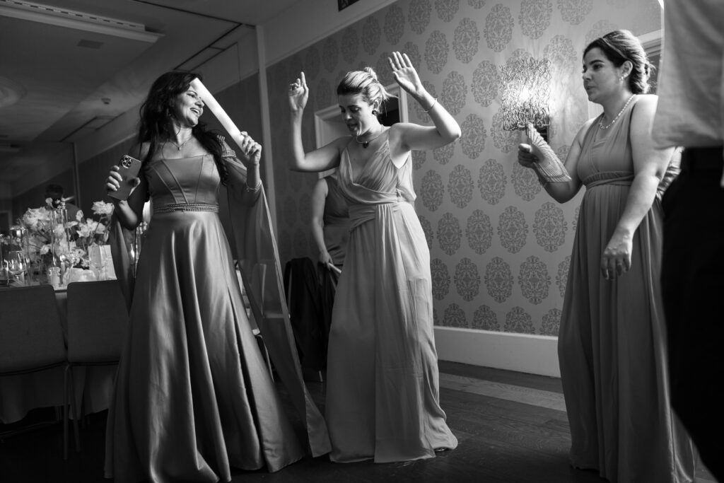 Guests dancing and celebrating during the wedding party at Schloss Hünigen in Bern