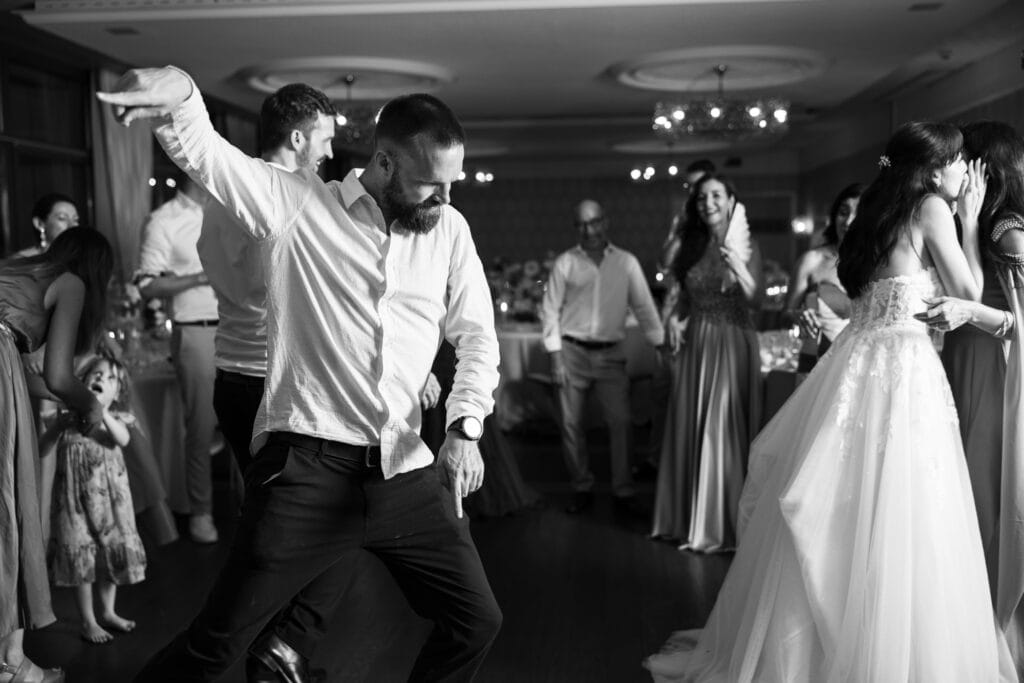 Guests dancing and celebrating during the wedding party at Schloss Hünigen in Bern