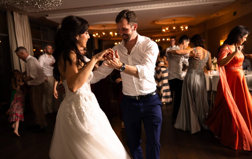 Bride and groom dancing and celebrating during the wedding party at Schloss Hünigen in Bern