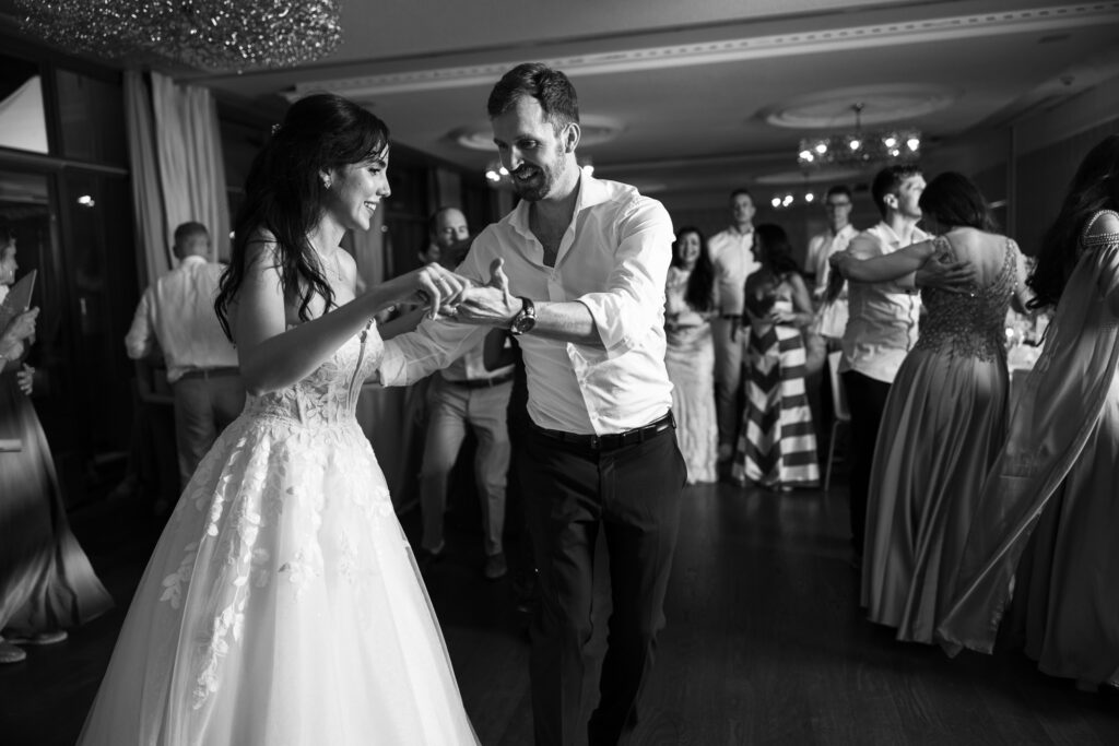 Bride and groom dancing and celebrating during the wedding party at Schloss Hünigen in Bern