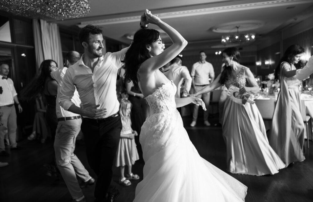 Bride and groom dancing and celebrating during the wedding party at Schloss Hünigen in Bern