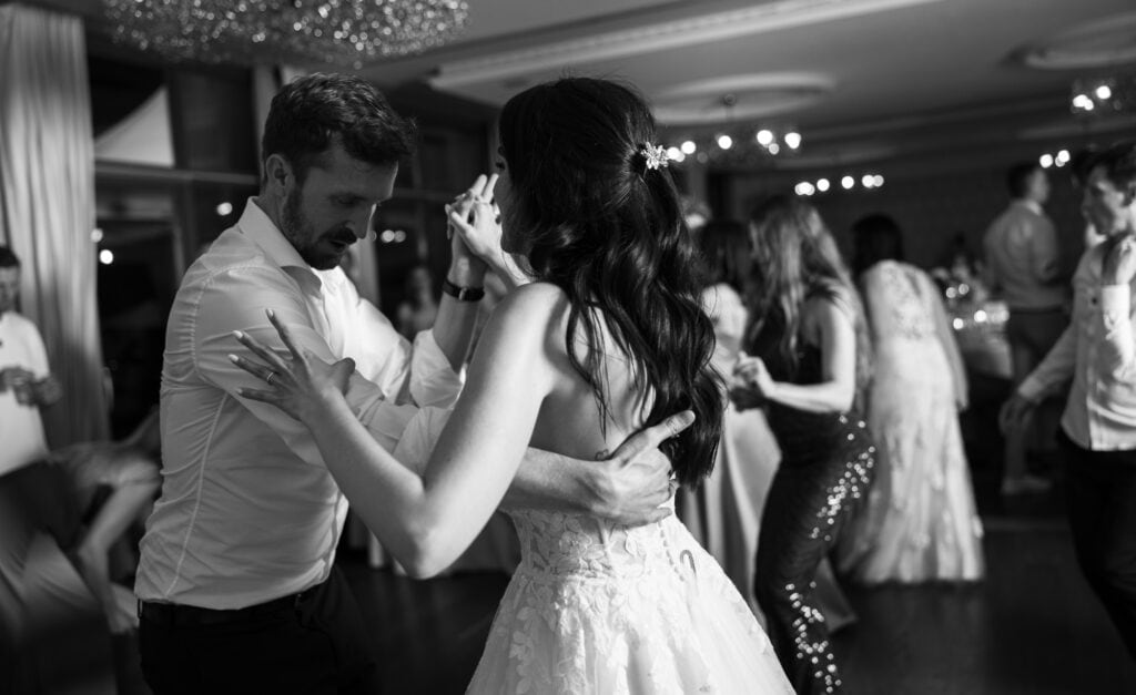 Bride and groom dancing and celebrating during the wedding party at Schloss Hünigen in Bern