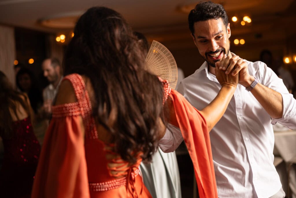 Guests dancing and celebrating during the wedding party at Schloss Hünigen in Bern