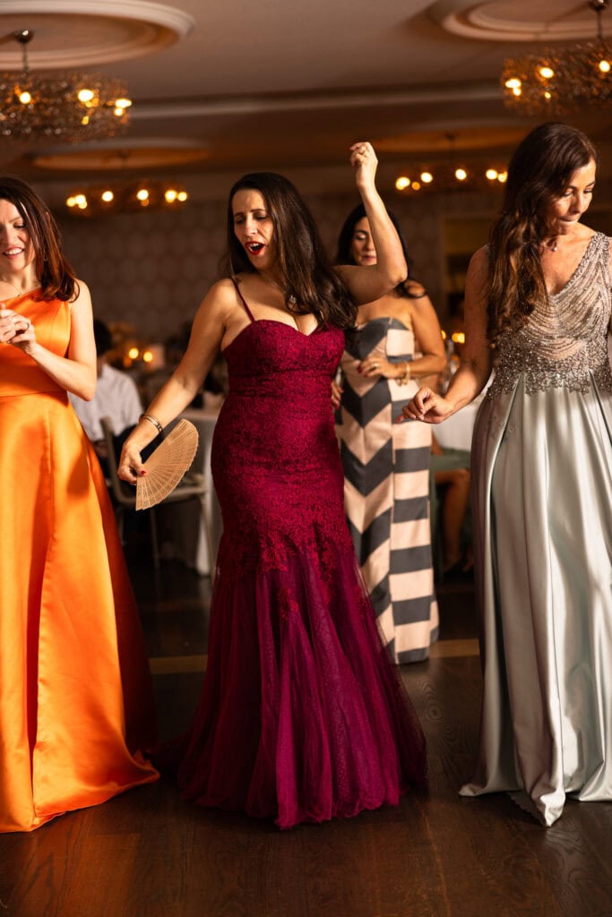 Guests dancing and celebrating during the wedding party at Schloss Hünigen in Bern