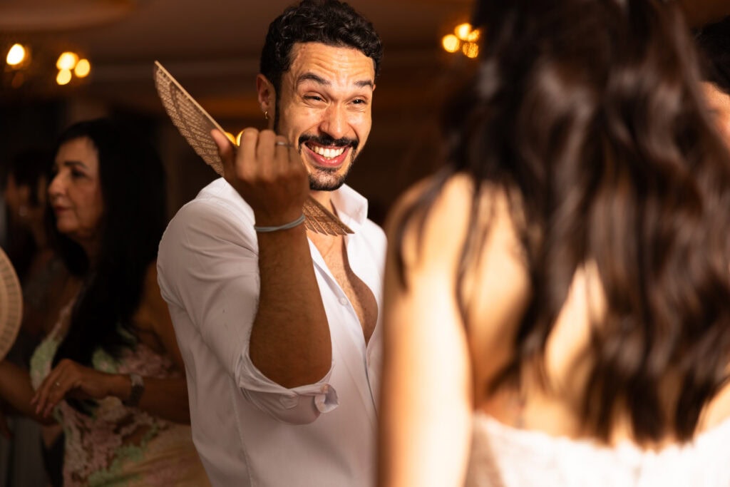 Guests dancing and celebrating during the wedding party at Schloss Hünigen in Bern