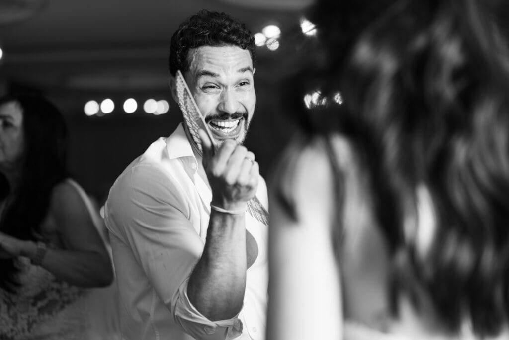 Guests dancing and celebrating during the wedding party at Schloss Hünigen in Bern