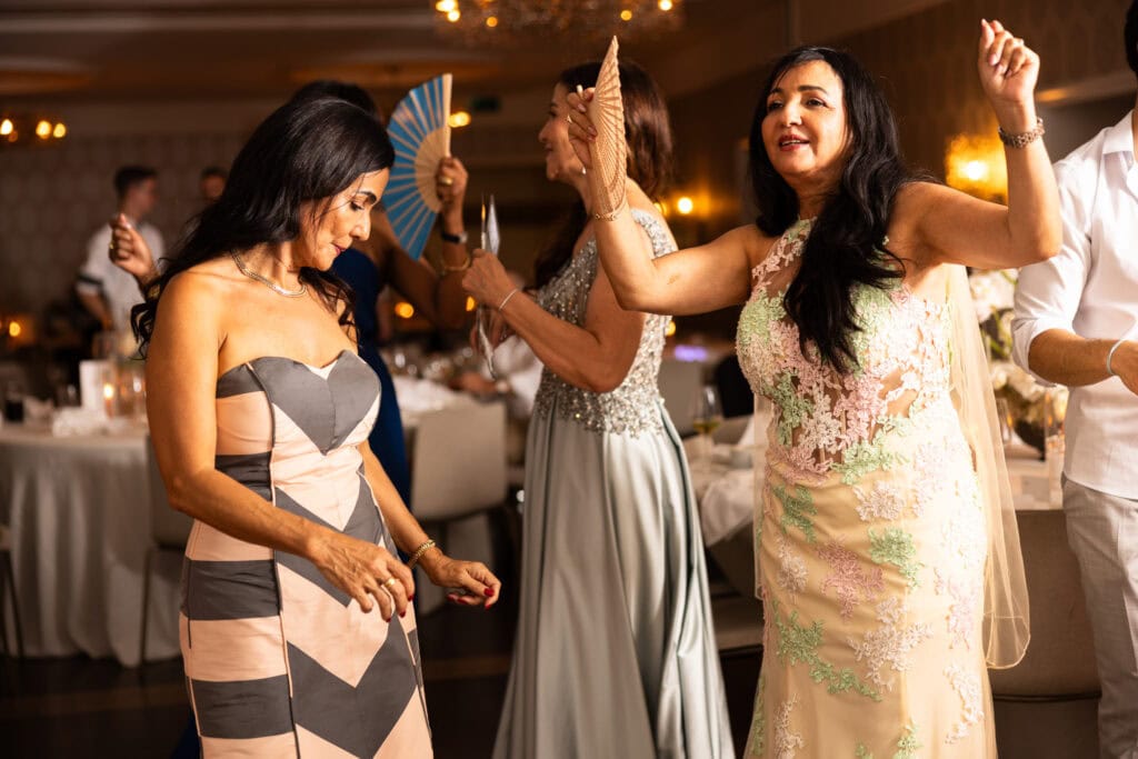 Guests dancing and celebrating during the wedding party at Schloss Hünigen in Bern