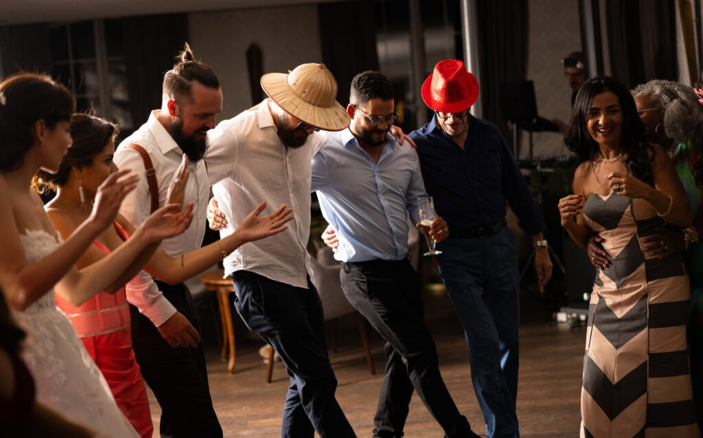 Guests dancing and celebrating during the wedding party at Schloss Hünigen in Bern