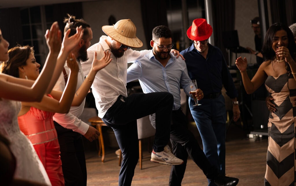 Guests dancing and celebrating during the wedding party at Schloss Hünigen in Bern