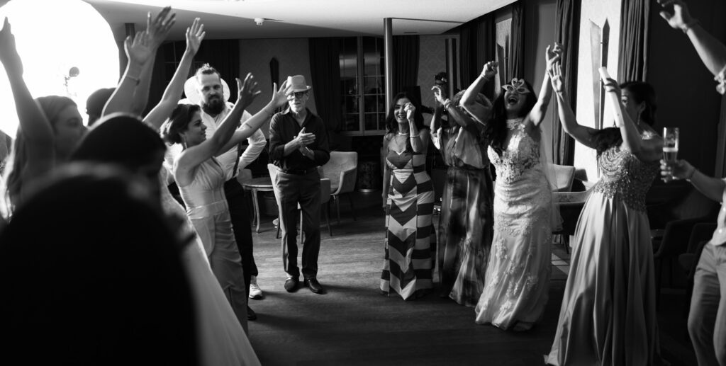 Guests dancing and celebrating during the wedding party at Schloss Hünigen in Bern