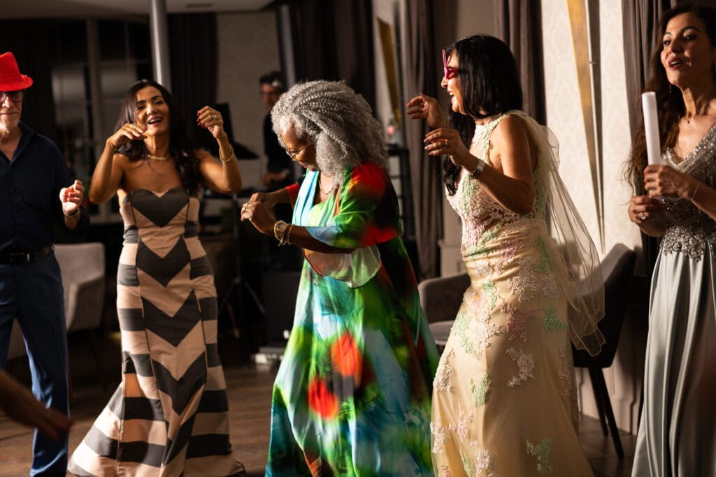 Guests dancing and celebrating during the wedding party at Schloss Hünigen in Bern