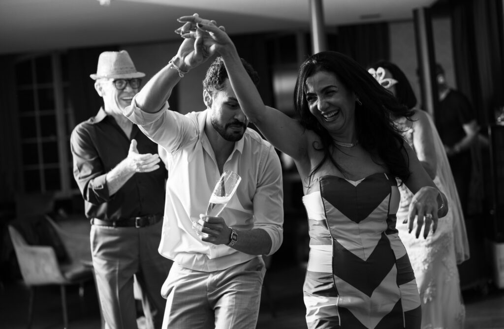 Guests dancing and celebrating during the wedding party at Schloss Hünigen in Bern