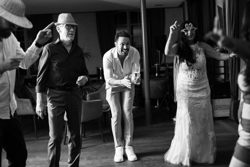Guests dancing and celebrating during the wedding party at Schloss Hünigen in Bern