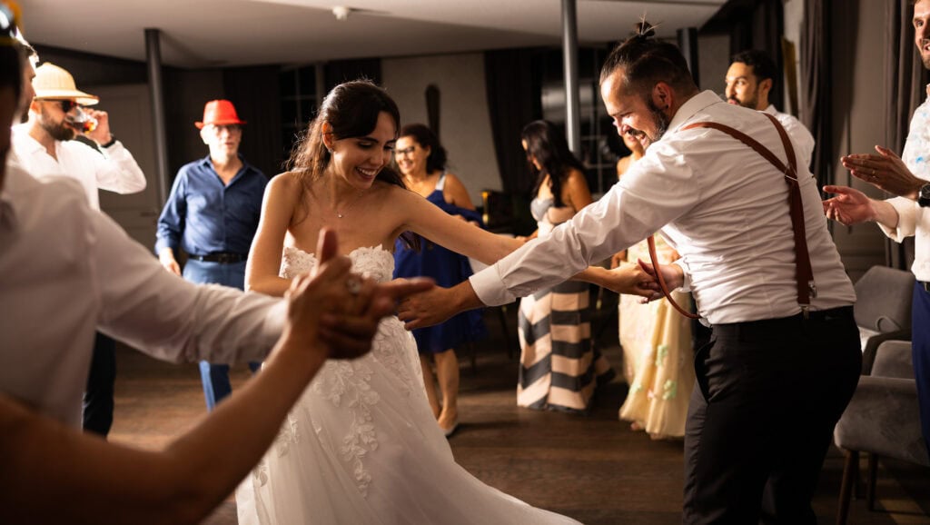 Bride and groom dancing and celebrating during the wedding party at Schloss Hünigen in Bern