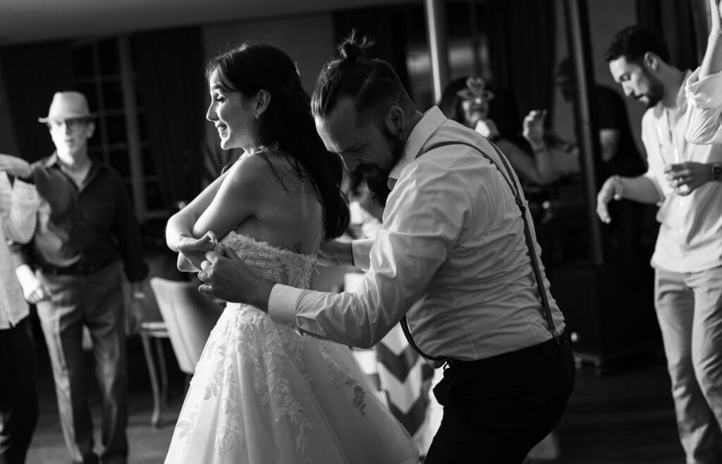 Bride and groom dancing and celebrating during the wedding party at Schloss Hünigen in Bern