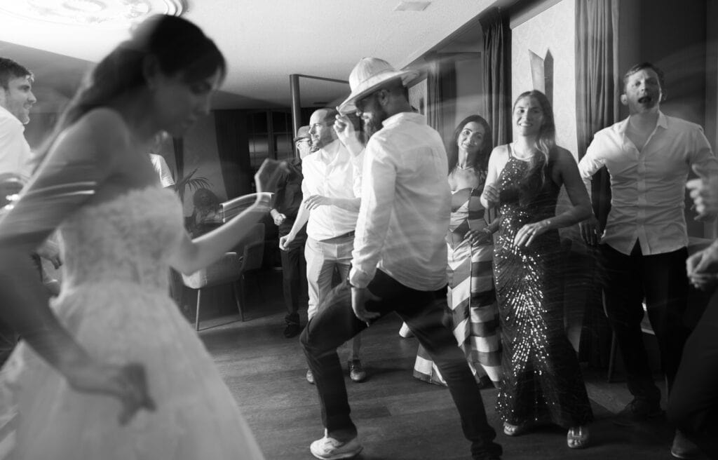Guests dancing and celebrating during the wedding party at Schloss Hünigen in Bern