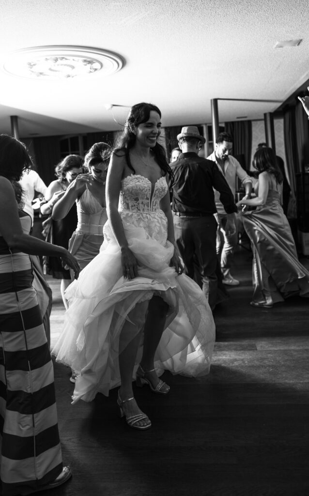 Bride and groom dancing and celebrating during the wedding party at Schloss Hünigen in Bern