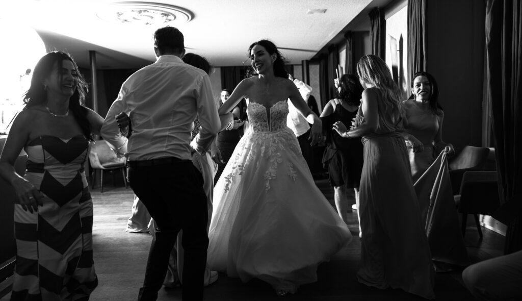 Bride and groom dancing and celebrating during the wedding party at Schloss Hünigen in Bern