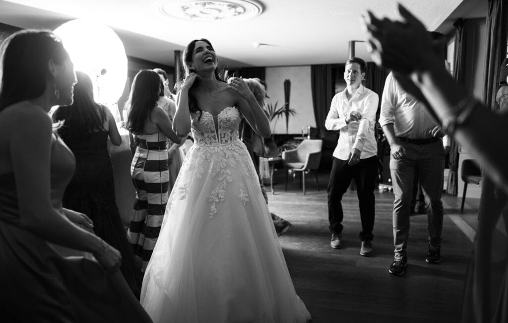 Bride and groom dancing and celebrating during the wedding party at Schloss Hünigen in Bern