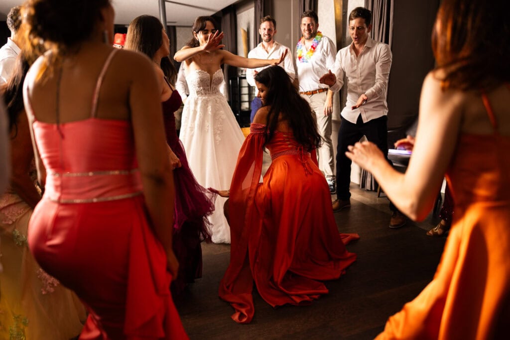 Guests dancing and celebrating during the wedding party at Schloss Hünigen in Bern