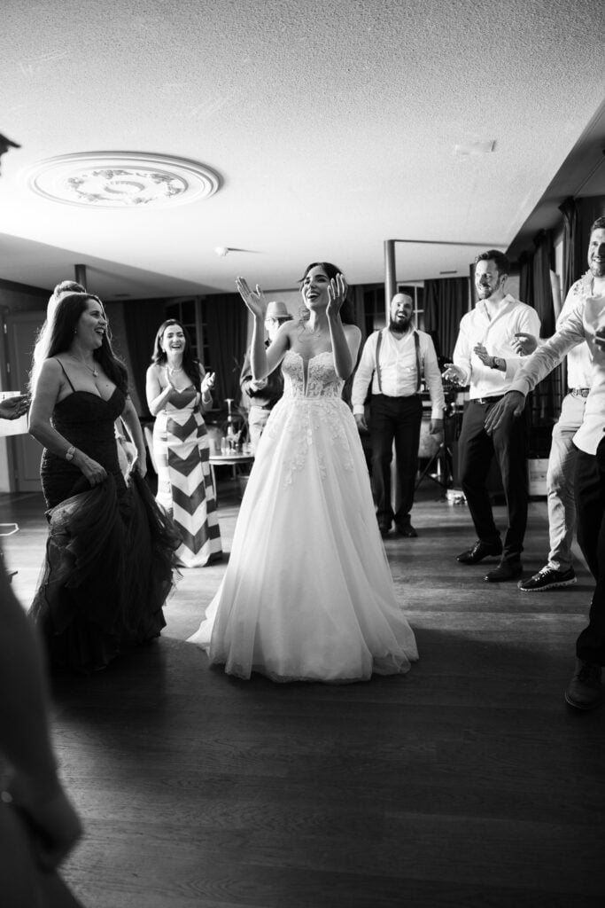 Bride and groom dancing and celebrating during the wedding party at Schloss Hünigen in Bern