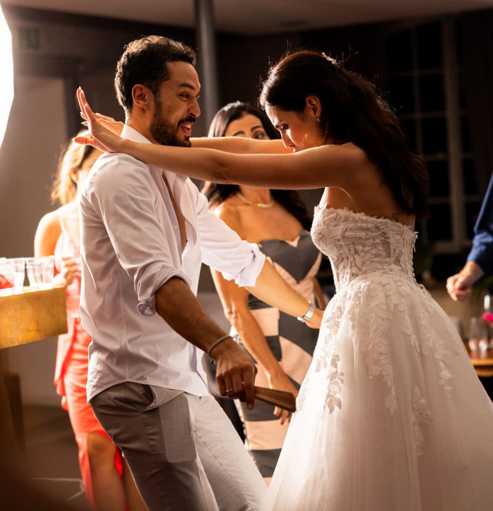 Bride and groom dancing and celebrating during the wedding party at Schloss Hünigen in Bern