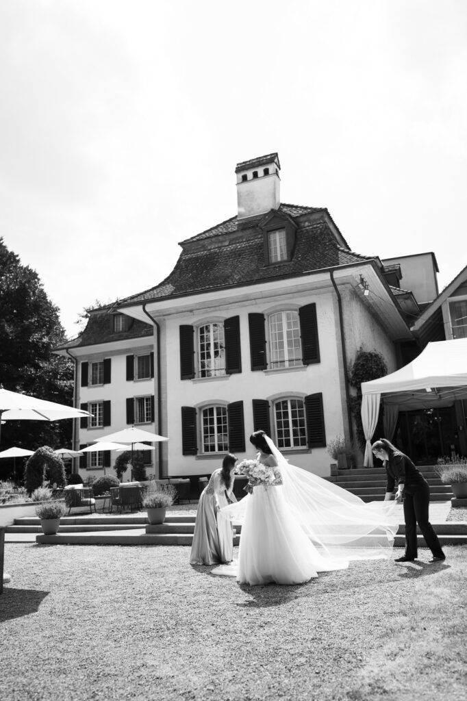 Wedding ceremony in the garden. Schloss Hünigen. Emotional and colorful wedding ceremony. Entry bride and her mum