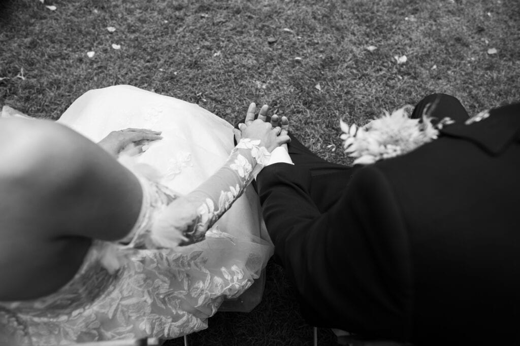 Wedding ceremony in the garden. Schloss Hünigen. Emotional and colorful wedding ceremony. Hands