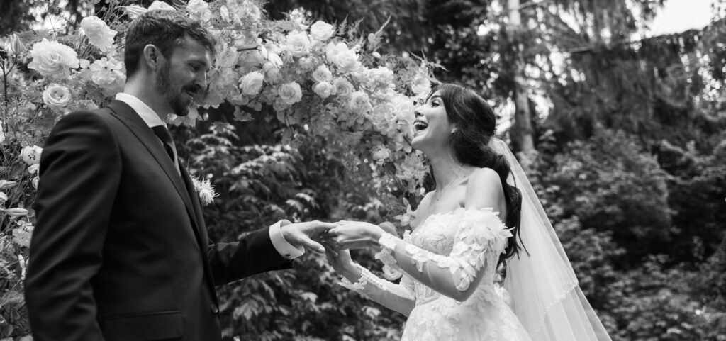 Wedding ceremony in the garden. Schloss Hünigen. Emotional and colorful wedding ceremony. Wedding rings moment