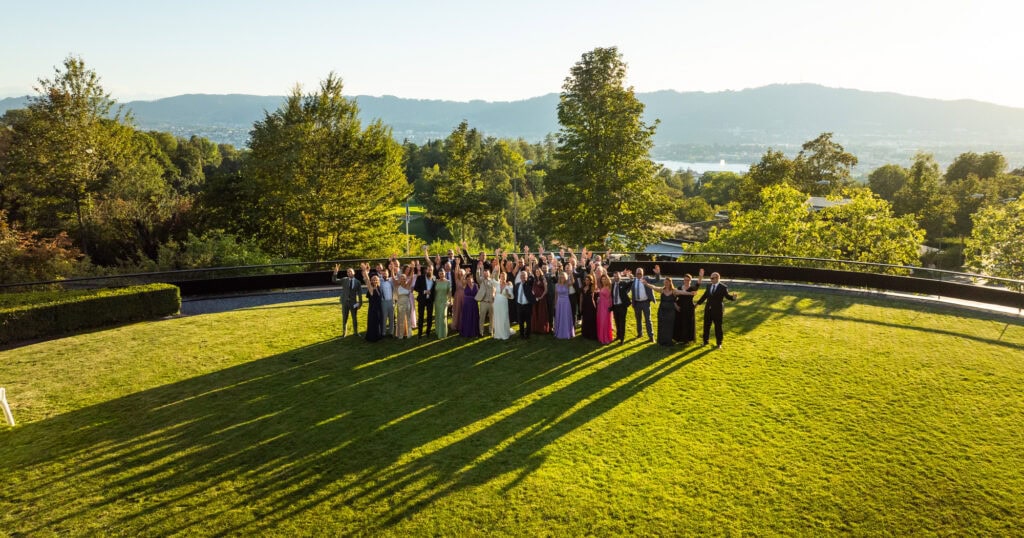 Wedding at Grand Hotel Dolder, Zürich. Sunset photoshoot. Group photo, drone shot