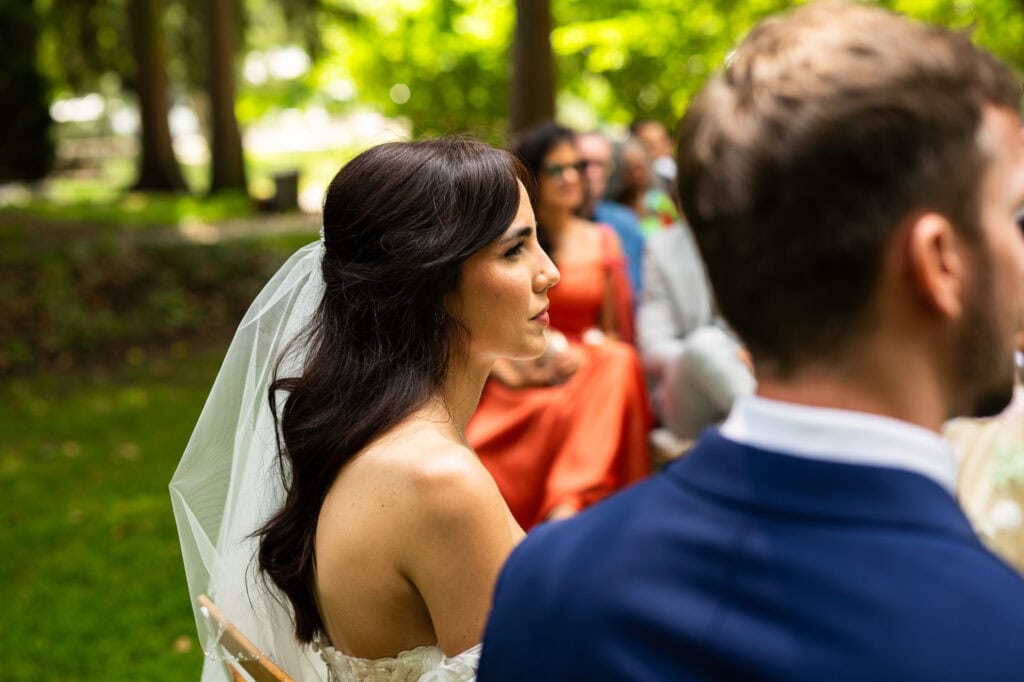 Wedding ceremony in the garden. Schloss Hünigen. Emotional and colorful wedding ceremony.