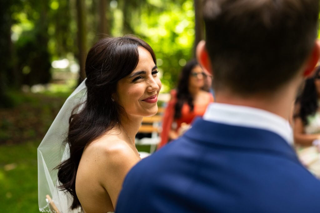Wedding ceremony in the garden. Schloss Hünigen. Emotional and colorful wedding ceremony.