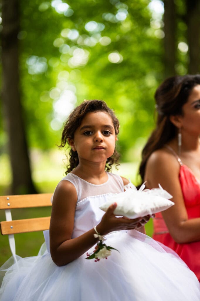 Wedding ceremony in the garden. Schloss Hünigen. Emotional and colorful wedding ceremony. Kid