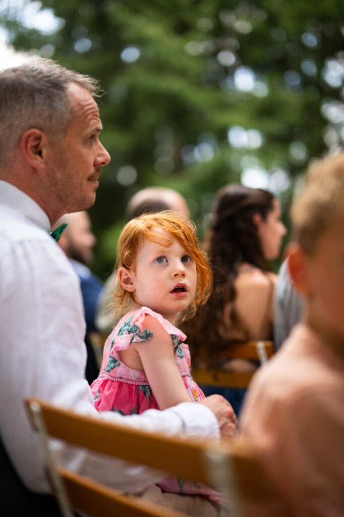 Wedding ceremony in the garden. Schloss Hünigen. Emotional and colorful wedding ceremony. Kid