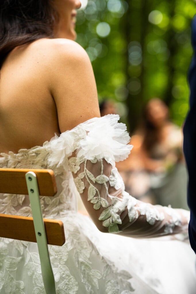 Wedding ceremony in the garden. Schloss Hünigen. Emotional and colorful wedding ceremony. Wedding dress
