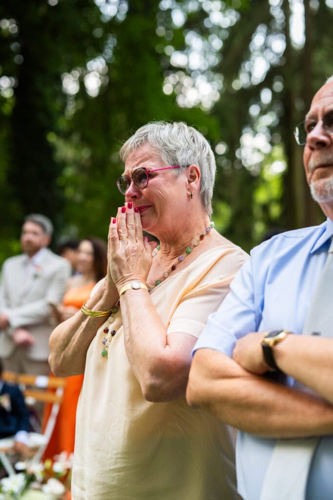 Wedding ceremony in the garden. Schloss Hünigen. Emotional and colorful wedding ceremony. Mum