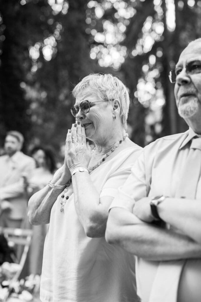 Wedding ceremony in the garden. Schloss Hünigen. Emotional and colorful wedding ceremony. Mum