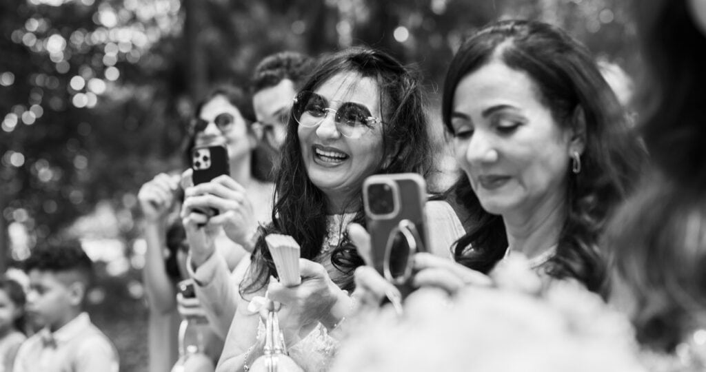 Wedding ceremony in the garden. Schloss Hünigen. Emotional and colorful wedding ceremony. Guests