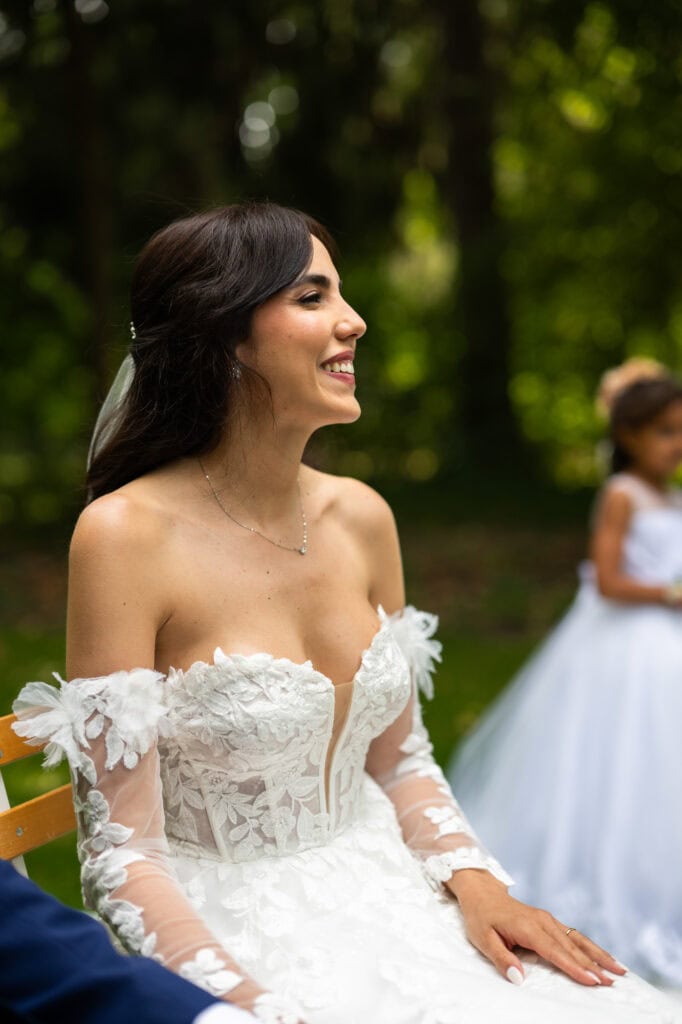Wedding ceremony in the garden. Schloss Hünigen. Emotional and colorful wedding ceremony. Bride