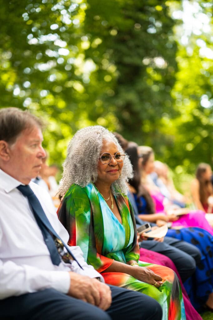 Wedding ceremony in the garden. Schloss Hünigen. Emotional and colorful wedding ceremony. Guests