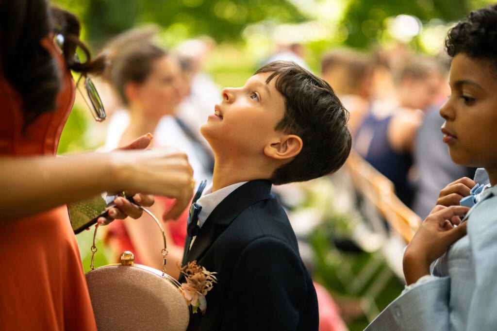 Wedding ceremony in the garden. Schloss Hünigen. Emotional and colorful wedding ceremony. Kid