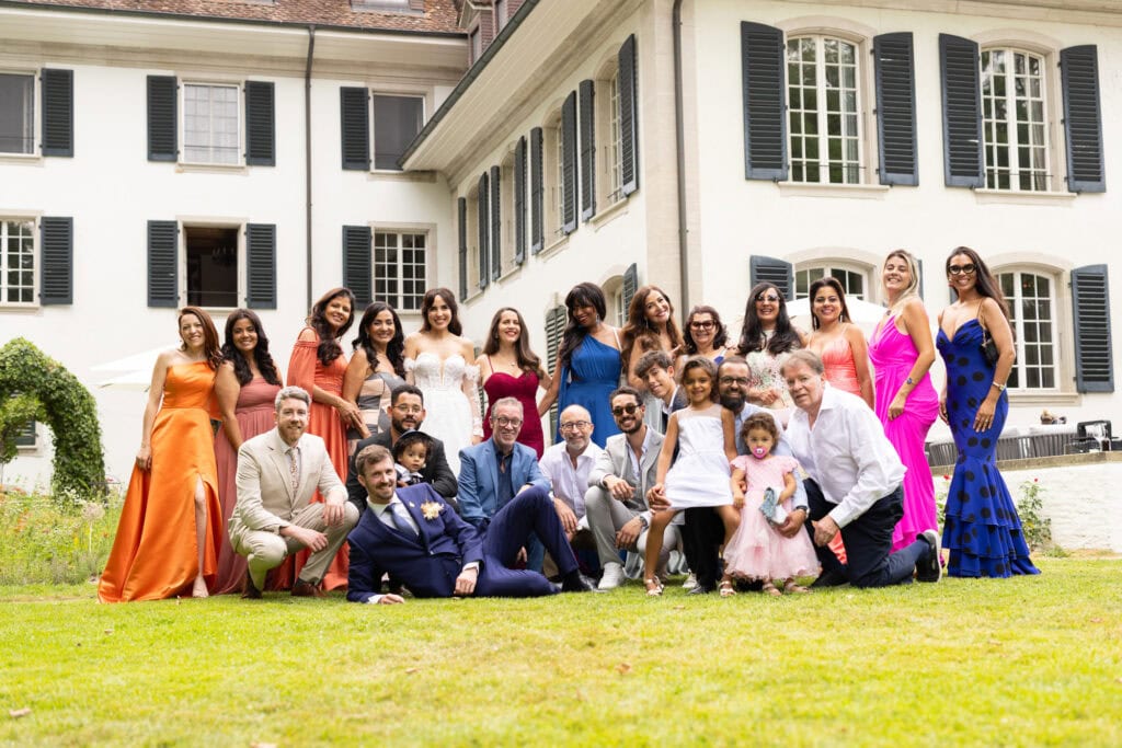 Group photo after the ceremony during their wedding at Schloss Hünigen in Bern