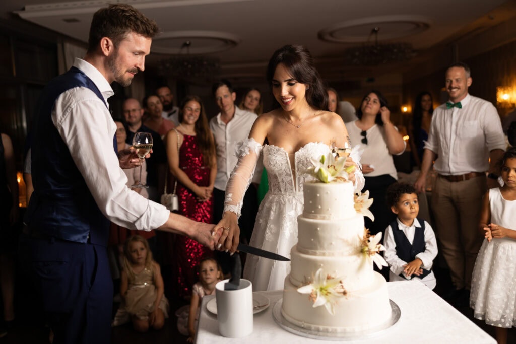 Wedding cake displayed during the reception at Schloss Hünigen in Bern